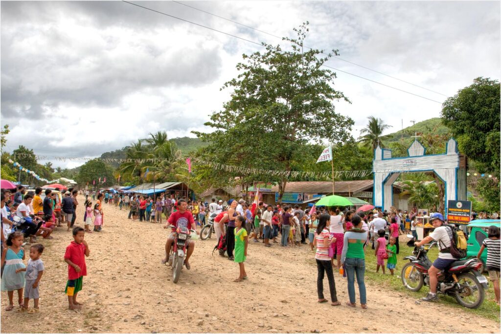 people celebrating fiesta in Barotuan, El Nido, Palawan, Philippines