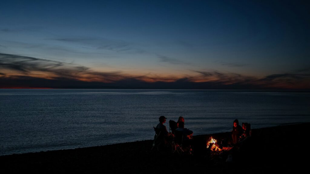 Group of people having a beach bonfire in Coron Palawan Philippines