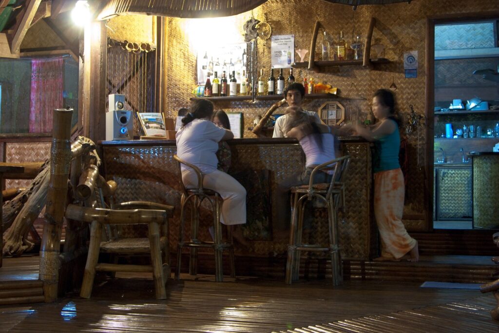 tourists spending the night at Sabang Beach bar in Puerto Princesa Palawan Philippines