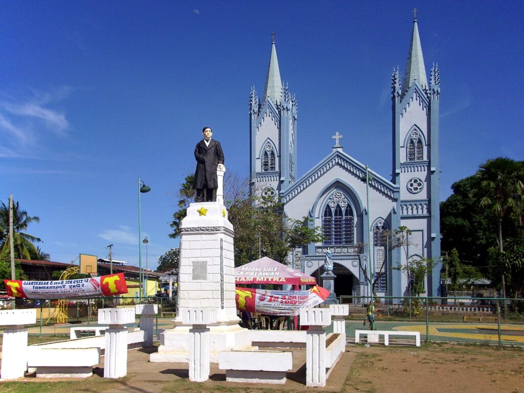 A statue of Jose Rizal in front of Immaculate Conception Cathedral in Puerto Princesa Palawan Philippines