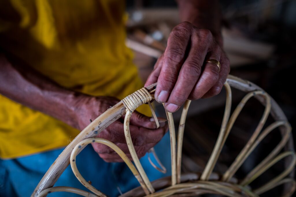 a worker making rattan furnitures