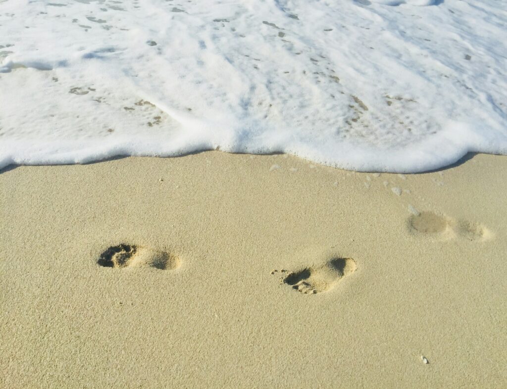 footstep of a human on a sunny white sand beach of Puerto Princesa Palawan