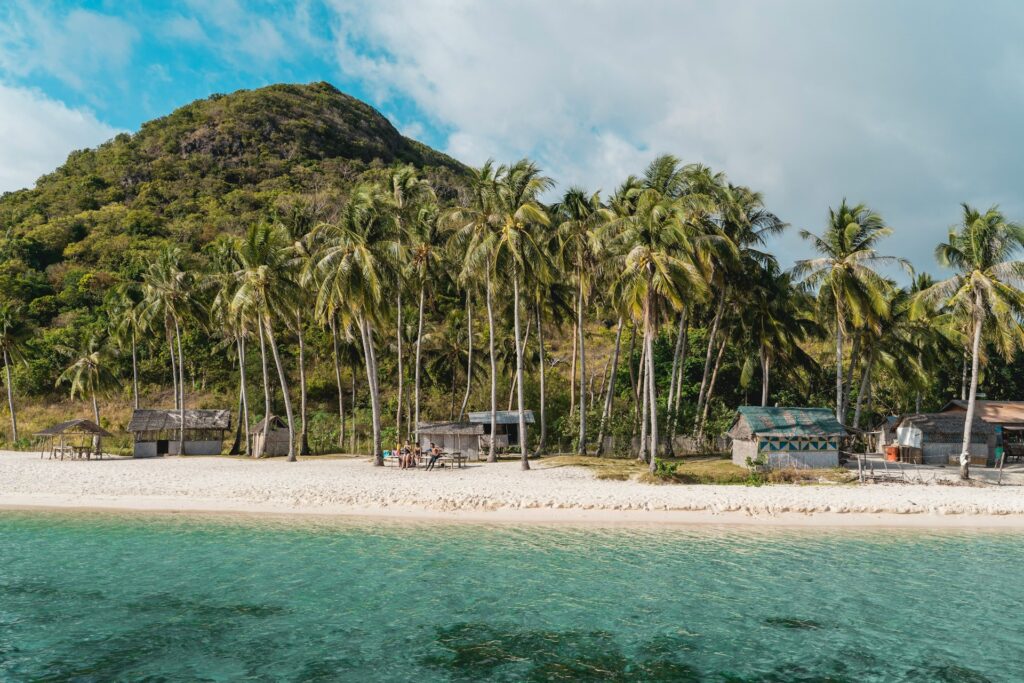 a white sand and crystal clear water beach of Culion Island in Palawan Philippines